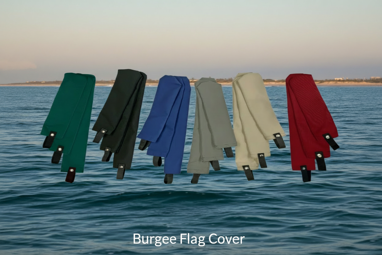 Group of colorful Sunbrella marine burgee flag covers in blue, green, and red.